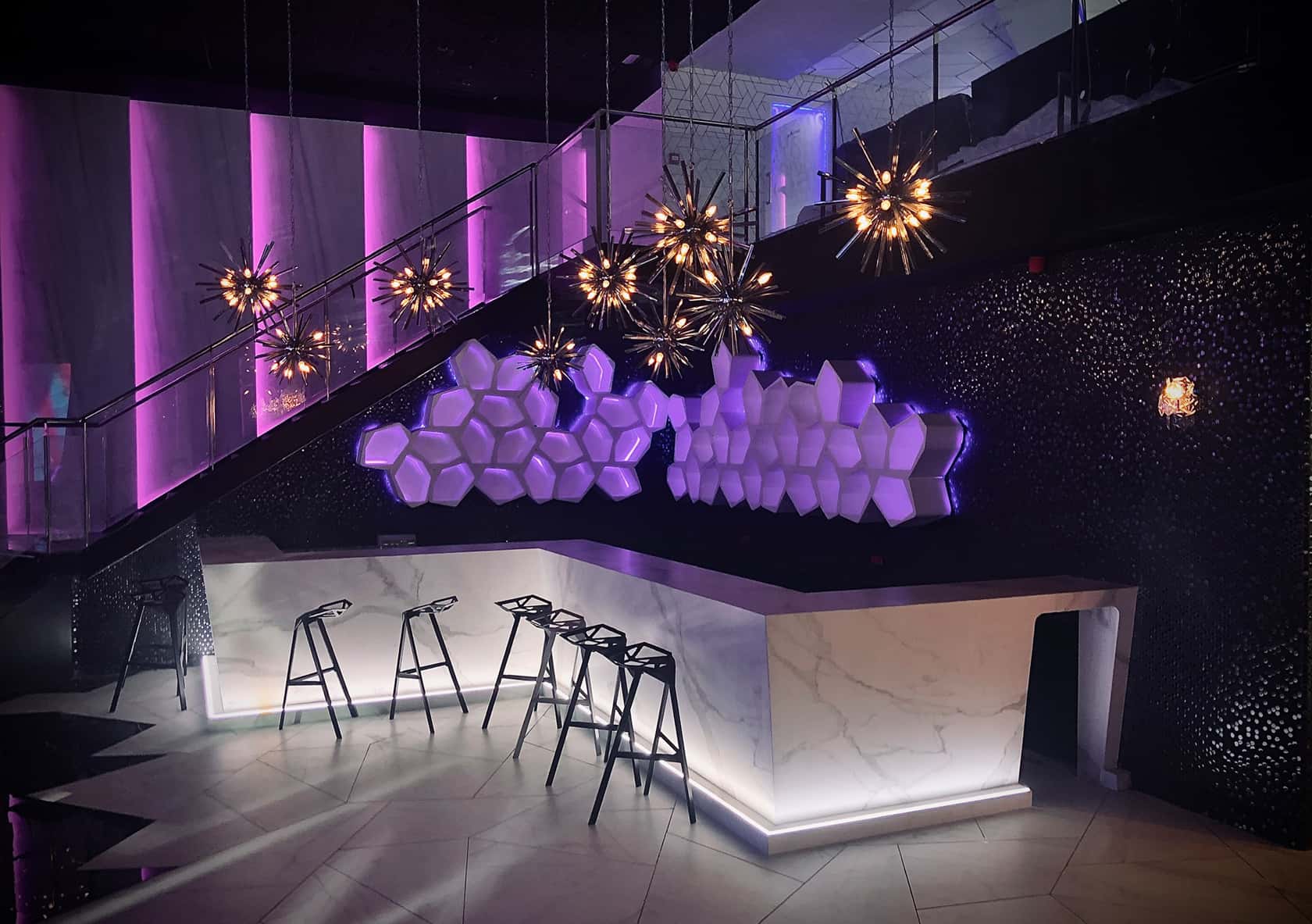 White BUILD modular shelves with pink light in the interior of BCM Mallorca
