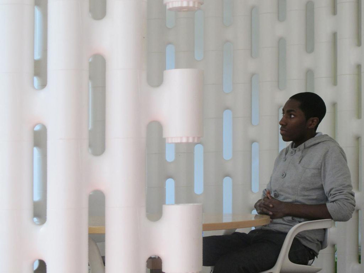 White freestanding LINK room divider as video call background